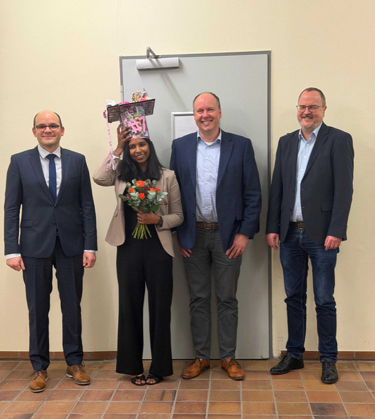 PhD defense of Malavika. From left to right: David Van Craen (supervisor and 1st examiner), Malavika G. Kalarikkal, Guido Clever (2nd examiner) and Stefan Kast (chairman of the defense)