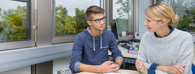 Study guidance Two persons sitting at a desk