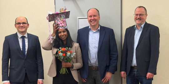 PhD defense of Malavika. From left to right: David Van Craen (supervisor and 1st examiner), Malavika G. Kalarikkal, Guido Clever (2nd examiner) and Stefan Kast (chairman of the defense)